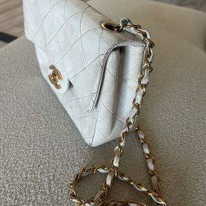 Used vintage authentic Chanel white lamb skin mini flap